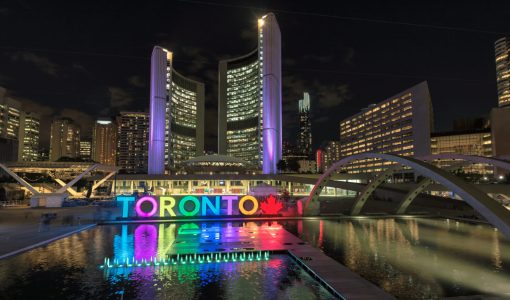 Toronto City Hall and Toronto sign in Nathan Phillips Square at
